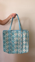 Hand-block printed quilted cotton tote bag. Featuring soft aqua tones with flowing ivory motifs.
