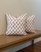 Hand Block printed throw pillow with floral motifs in soft pink on white.