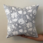 Hand Block printed throw pillow with floral Lotus vine motifs in muted gray and white.