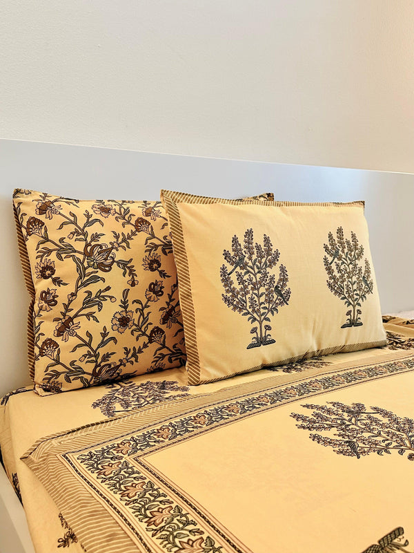 Foundation Edit Parrot Perch hand-block printed South Cotton bedsheet set by DewDropHues, featuring an intricate tree and parrot motif and breathable heritage weave.