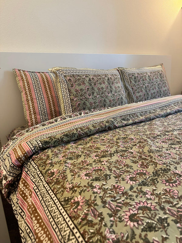 Foundation Edit Floral Kaleidoscope hand-block printed South Cotton bedsheet set by DewDropHues, featuring a vibrant botanical design and breathable heritage weave.