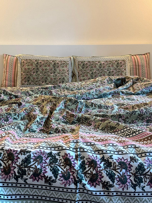Foundation Edit Floral Kaleidoscope hand-block printed South Cotton bedsheet set by DewDropHues, featuring a vibrant botanical design and breathable heritage weave.