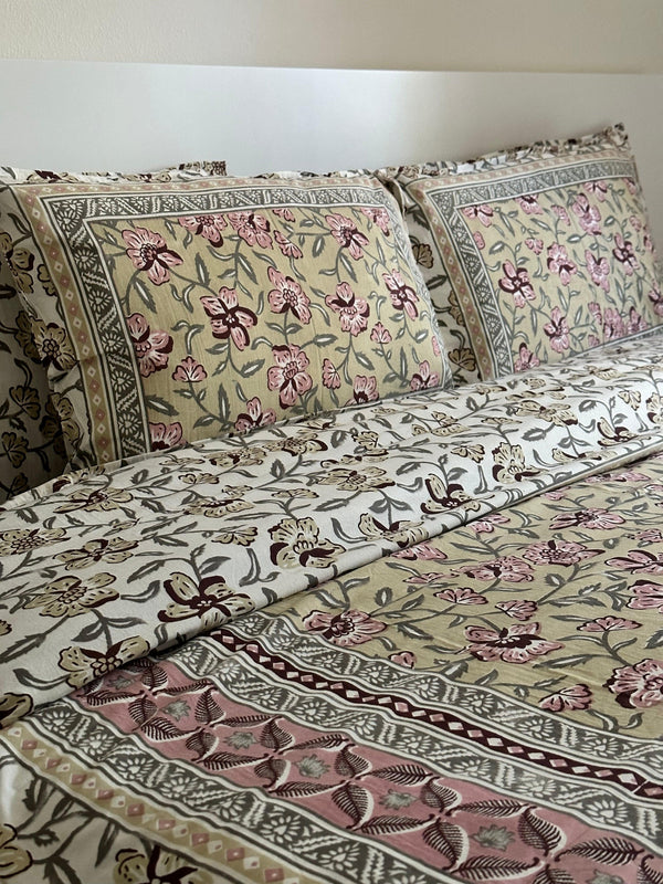 Foundation Edit Olive Blush hand-block printed South Cotton bedsheet set by DewDropHues, featuring a subtle floral design and breathable heritage weave.