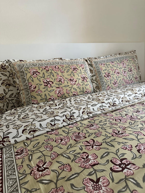Foundation Edit Olive Blush hand-block printed South Cotton bedsheet set by DewDropHues, featuring a subtle floral design and breathable heritage weave.