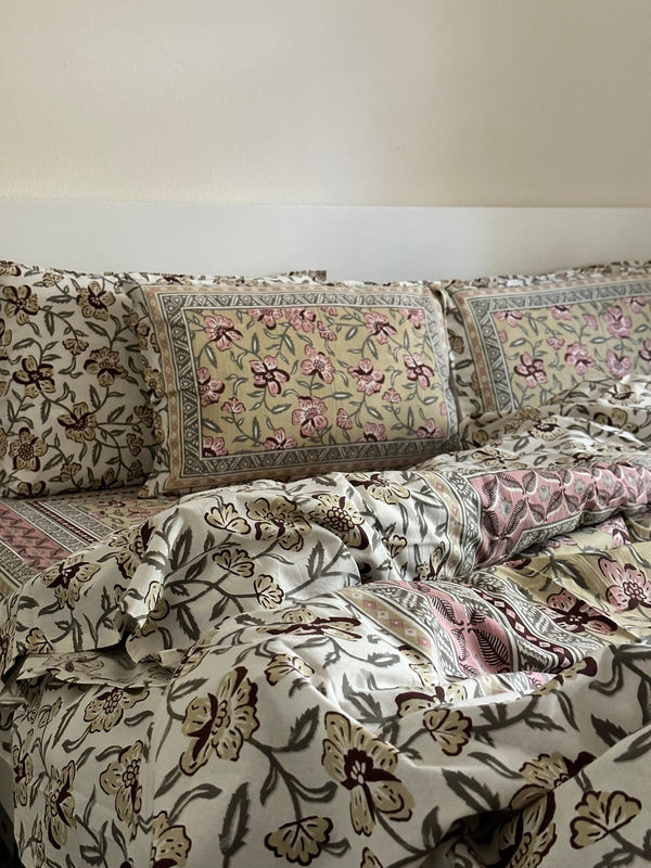 Foundation Edit Olive Blush hand-block printed South Cotton bedsheet set by DewDropHues, featuring a subtle floral design and breathable heritage weave.