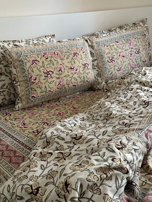 Foundation Edit Olive Blush hand-block printed South Cotton bedsheet set by DewDropHues, featuring a subtle floral design and breathable heritage weave.
