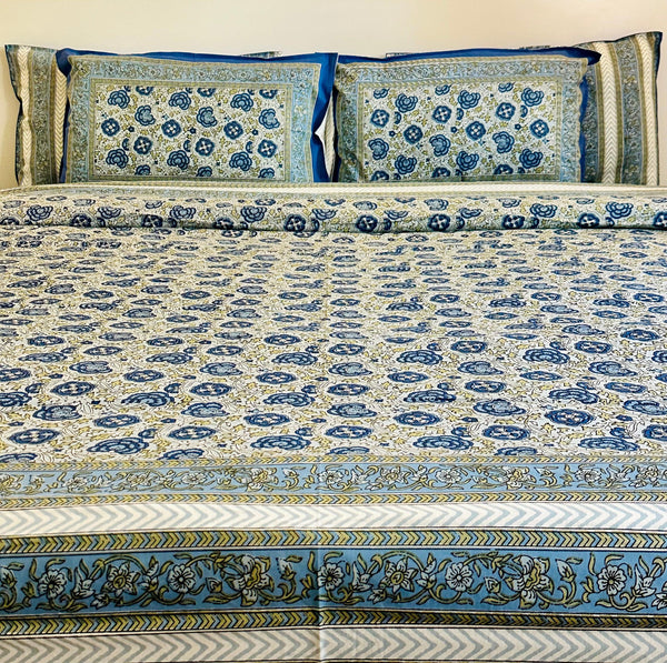 Foundation Edit Floral Kaleidoscope hand-block printed South Cotton bedsheet set by DewDropHues, featuring a vibrant botanical design and breathable heritage weave.