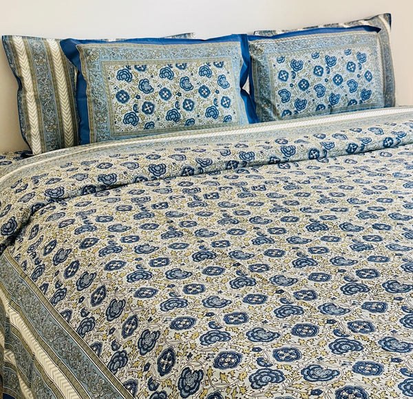 Foundation Edit Floral Kaleidoscope hand-block printed South Cotton bedsheet set by DewDropHues, featuring a vibrant botanical design and breathable heritage weave.