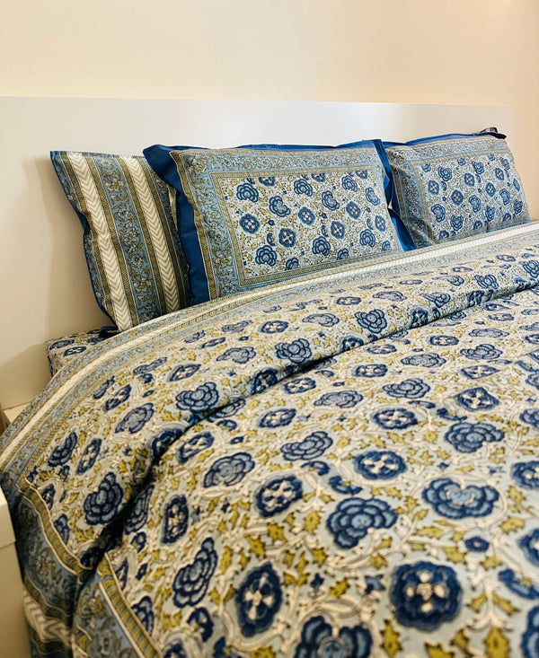 Foundation Edit Floral Kaleidoscope hand-block printed South Cotton bedsheet set by DewDropHues, featuring a vibrant botanical design and breathable heritage weave.