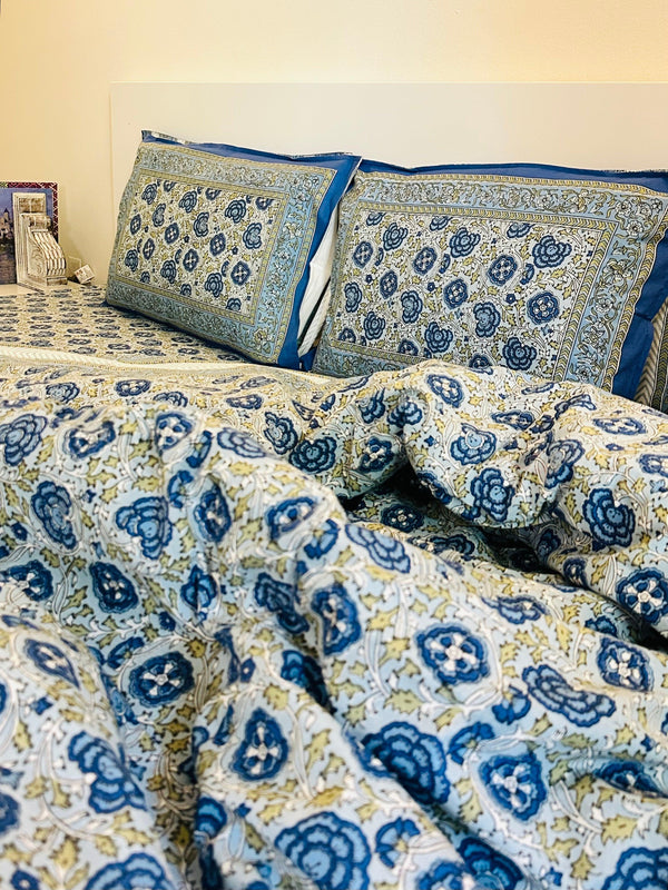 Foundation Edit Floral Kaleidoscope hand-block printed South Cotton bedsheet set by DewDropHues, featuring a vibrant botanical design and breathable heritage weave.