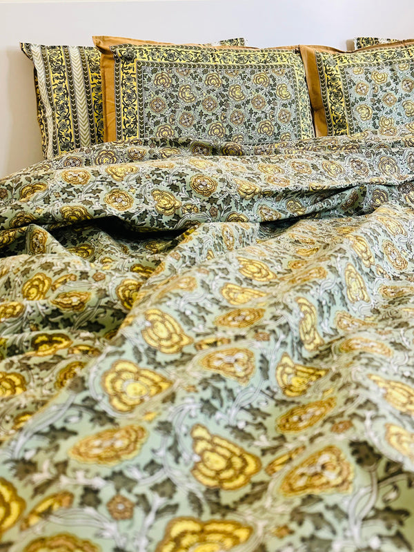Foundation Edit Floral Kaleidoscope hand-block printed South Cotton bedsheet set by DewDropHues, featuring a vibrant botanical design and breathable heritage weave.