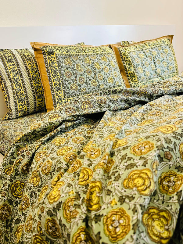 Foundation Edit Floral Kaleidoscope hand-block printed South Cotton bedsheet set by DewDropHues, featuring a vibrant botanical design and breathable heritage weave.