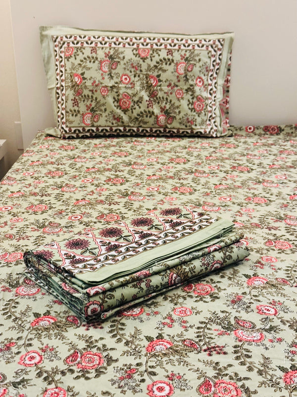 Foundation Edit Floral Kaleidoscope hand-block printed South Cotton bedsheet set by DewDropHues, featuring a vibrant botanical design and breathable heritage weave.
