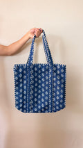 Hand-block printed quilted cotton tote bag. Featuring a rich indigo backdrop with delicate white botanical motifs.