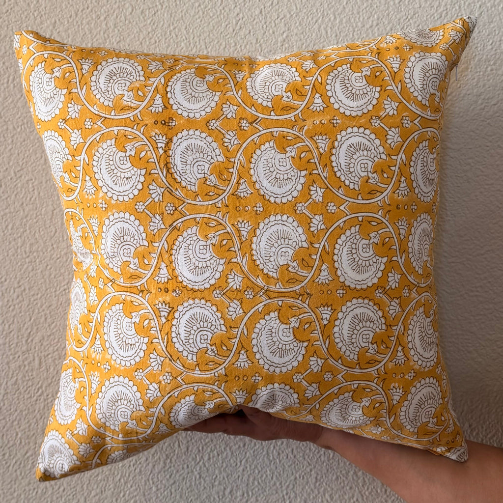 Hand Block printed throw pillow with floral vine motifs in bright ochre yellow and gray.