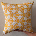 Hand Block printed throw pillow with floral vine motifs in bright ochre yellow and gray.