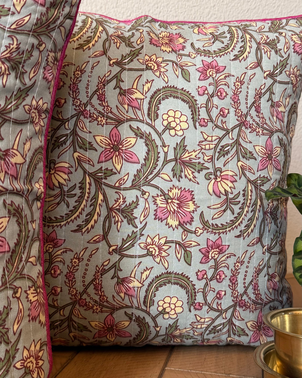 Zoomed in pillows of the sage blush pillows with floral block print.