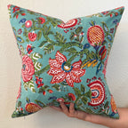 Hand Block printed throw pillow with floral motifs in bright Crimson and Turquoise.