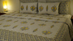 Foundation Edit Zesty Bliss hand-block printed South Cotton bedsheet set by DewDropHues, featuring a lemon motif design and premium yellow lattice border.