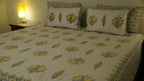 Foundation Edit Zesty Bliss hand-block printed South Cotton bedsheet set by DewDropHues, featuring a lemon motif design and premium yellow lattice border.