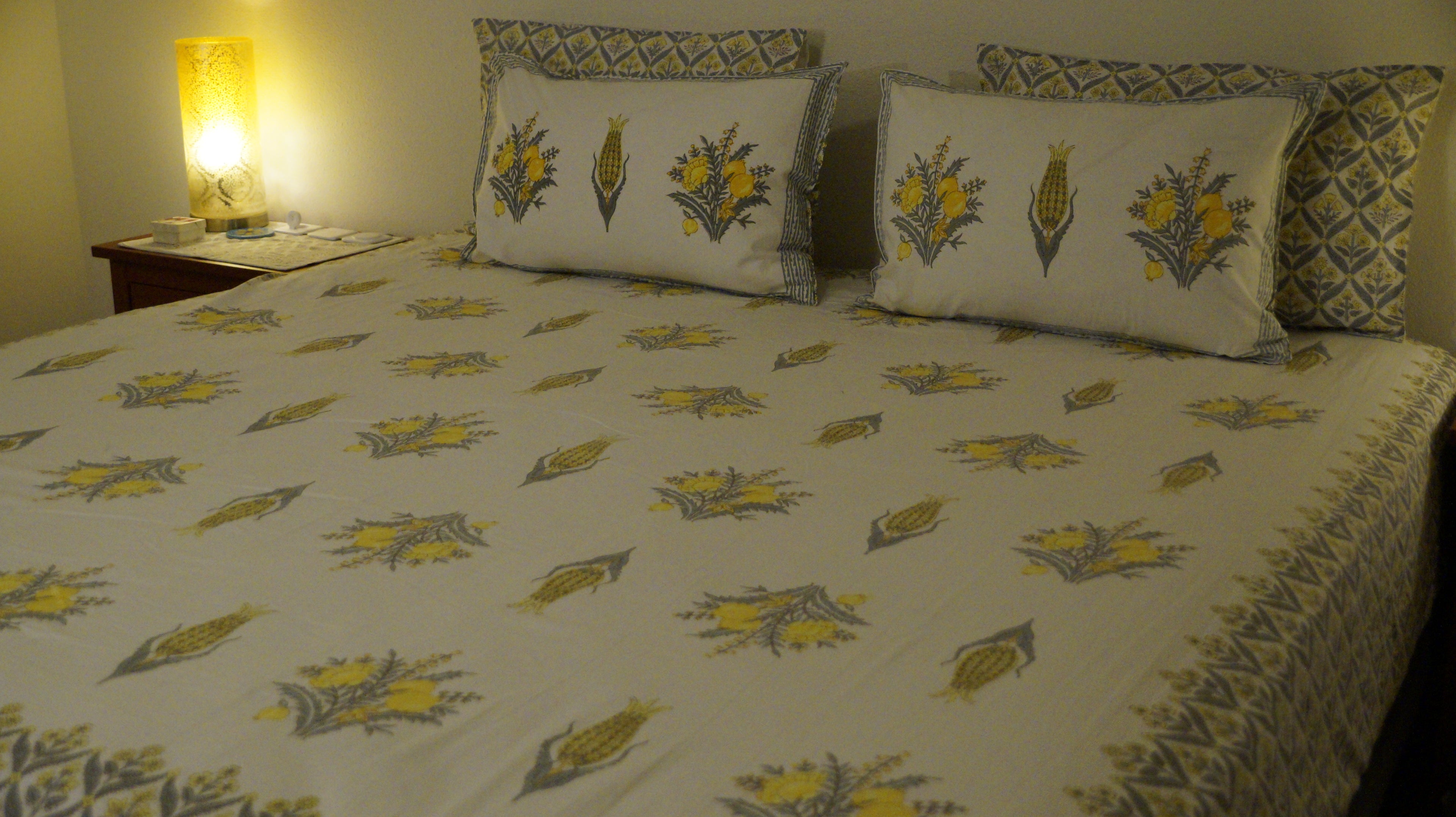 Foundation Edit Zesty Bliss hand-block printed South Cotton bedsheet set by DewDropHues, featuring a lemon motif design and premium yellow lattice border.