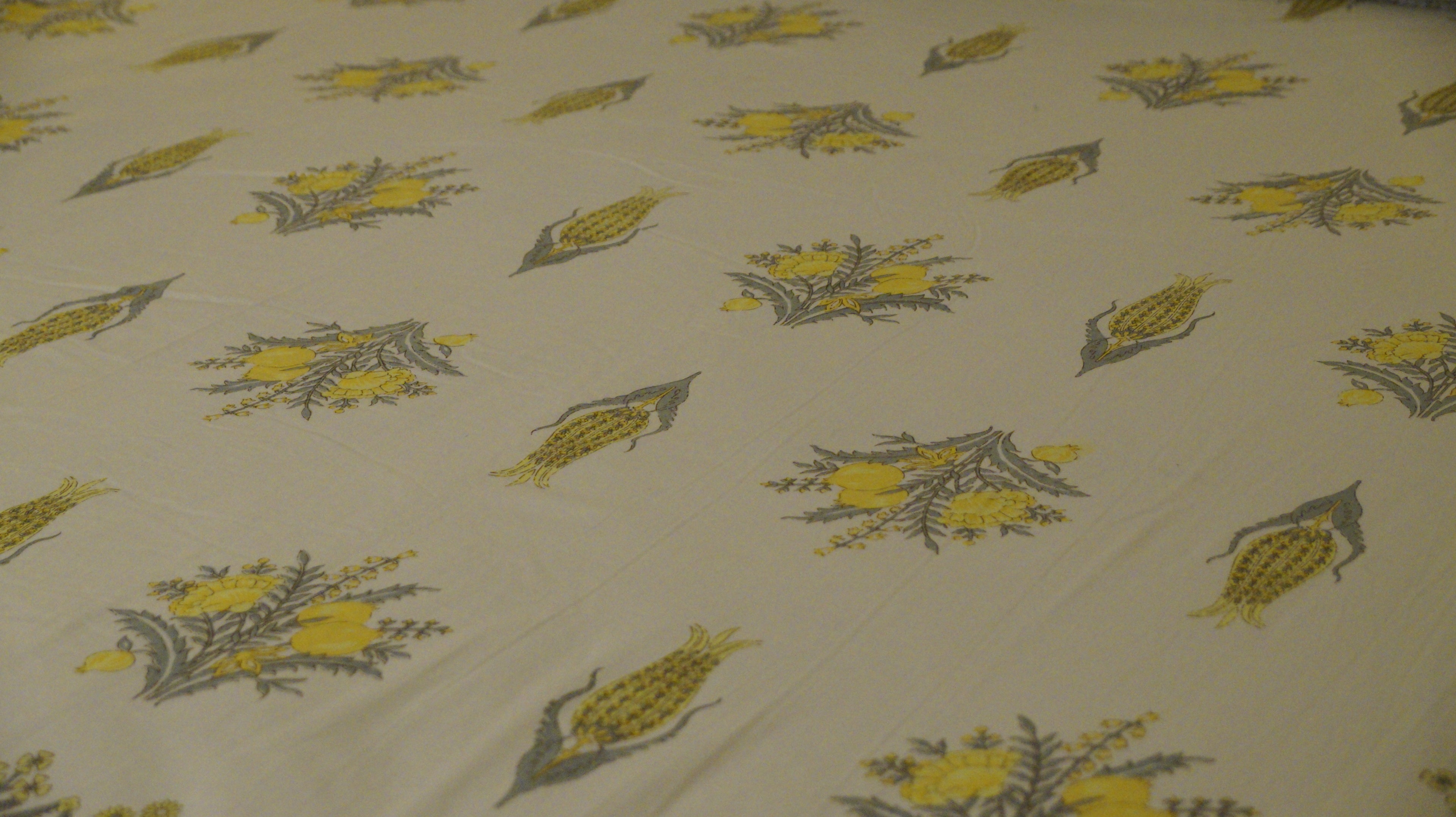 Foundation Edit Zesty Bliss hand-block printed South Cotton bedsheet set by DewDropHues, featuring a lemon motif design and premium yellow lattice border.