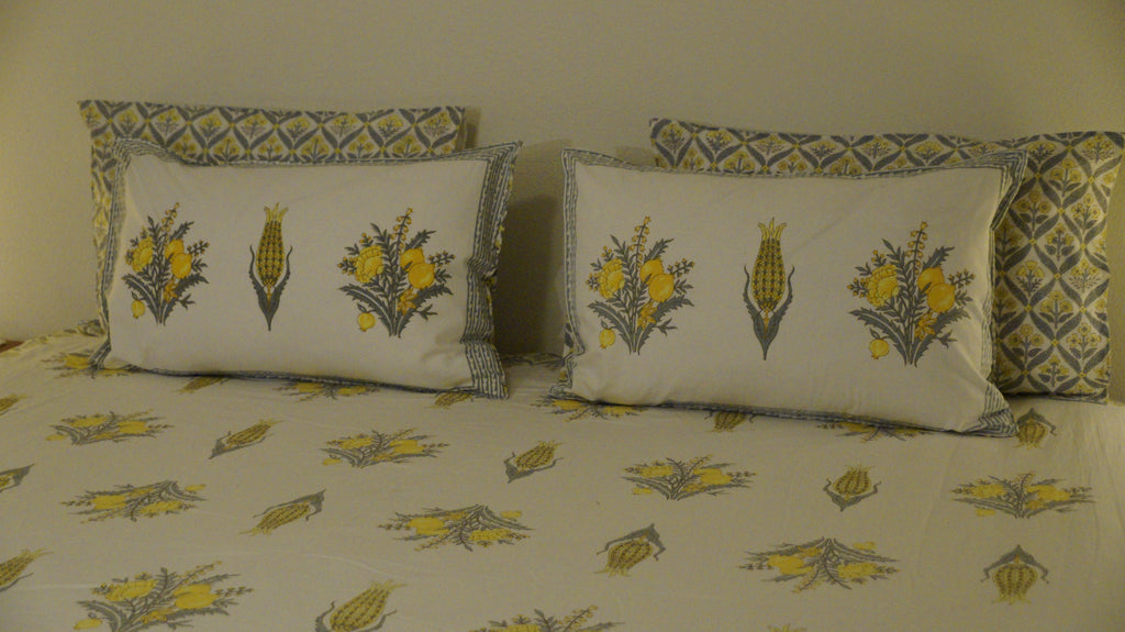 Foundation Edit Zesty Bliss hand-block printed South Cotton bedsheet set by DewDropHues, featuring a lemon motif design and premium yellow lattice border.